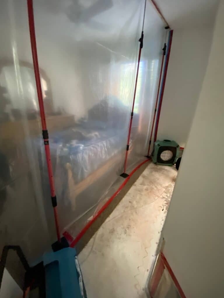 Sealed containment barrier and negative air setup during mold remediation
